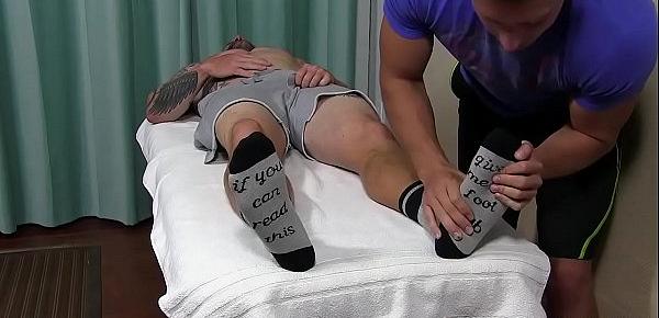  Inked hunk Clint has socks and feet sucked while jerking off